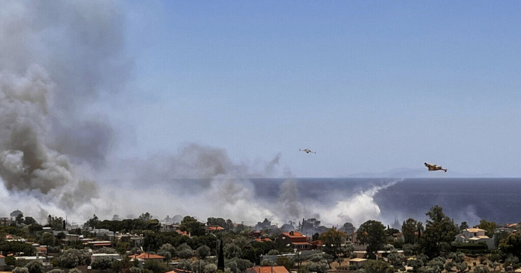 Communities evacuated amid wildfire near Athens as heatwave hits Greece