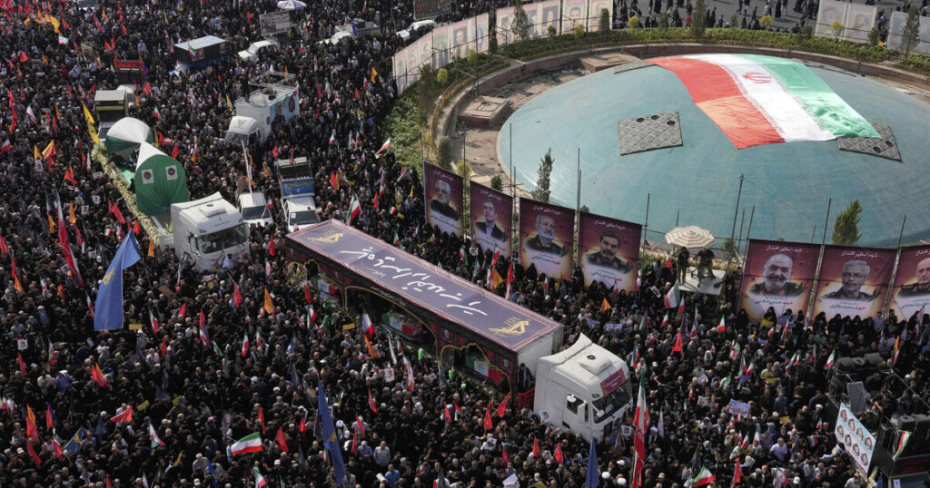 Huge crowds mourn Iranian military chiefs and scientists killed in strikes
