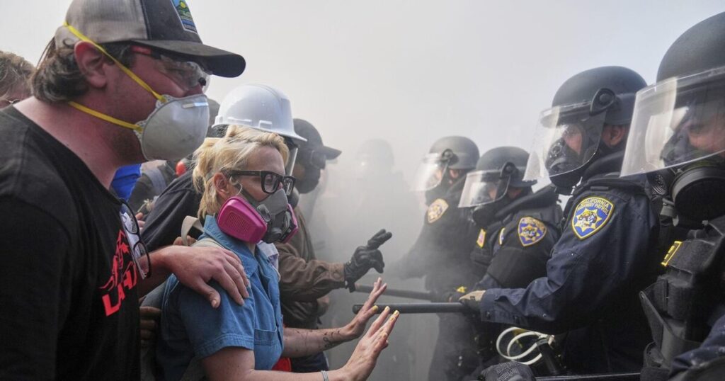 Los Angeles police order immigration protesters downtown to go home