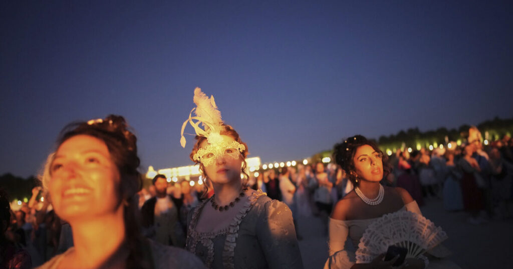Revellers in baroque costumes dance until dawn at masked ball