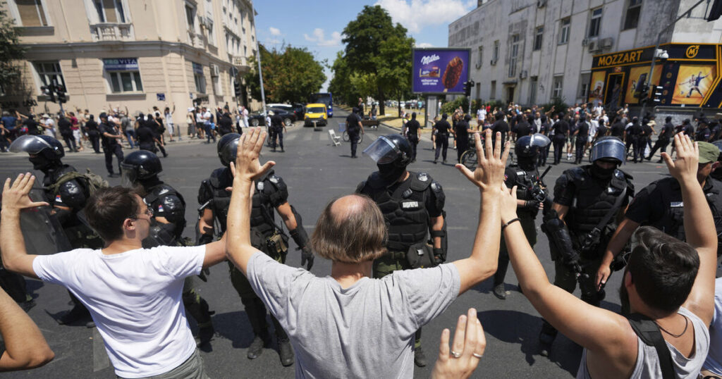 Serbian police remove barricades and make new arrests as protesters block roads