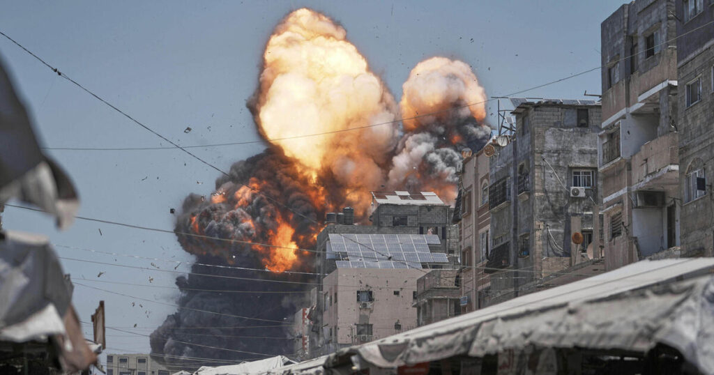 74 killed in Gaza as Israeli forces strike cafe and fire on people seeking food