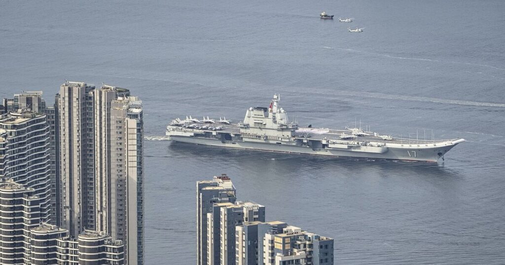 Chinese aircraft carrier sails into Hong Kong to boost patriotism