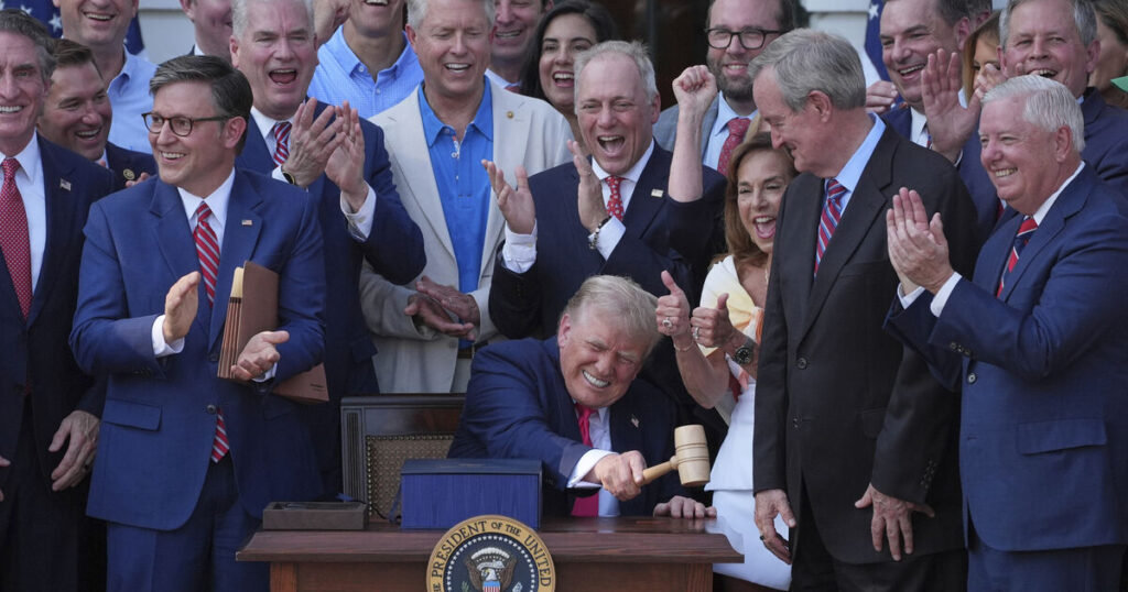 Trump signs tax and spending cut bill at White House July 4 picnic