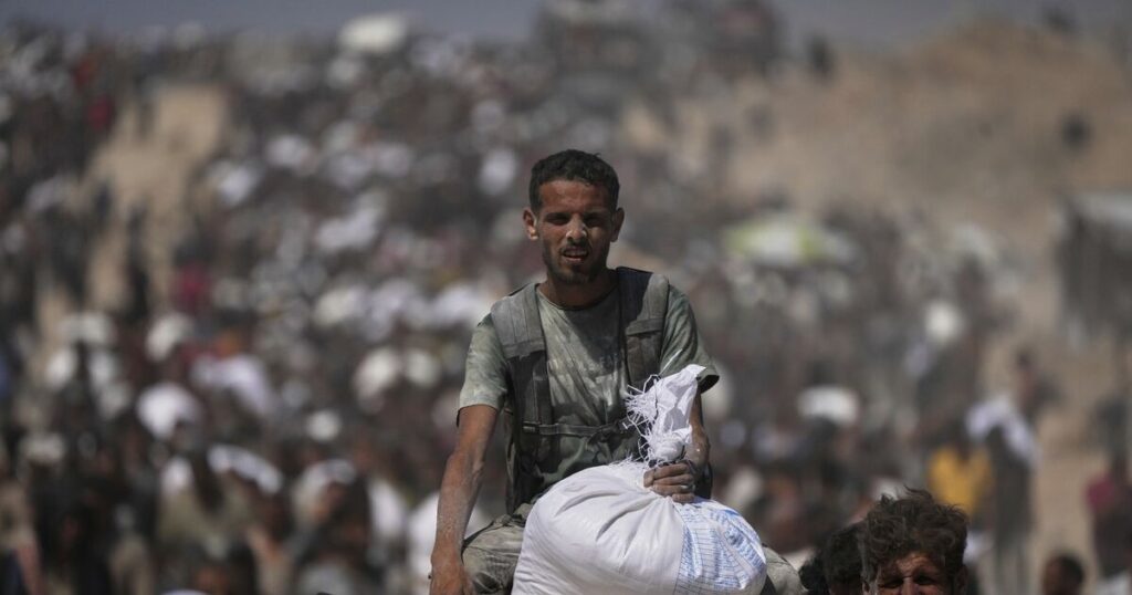 Eight people seeking food among at least 18 killed by Israeli fire in Gaza